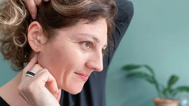 Ear: woman with hearing aid 1470514388