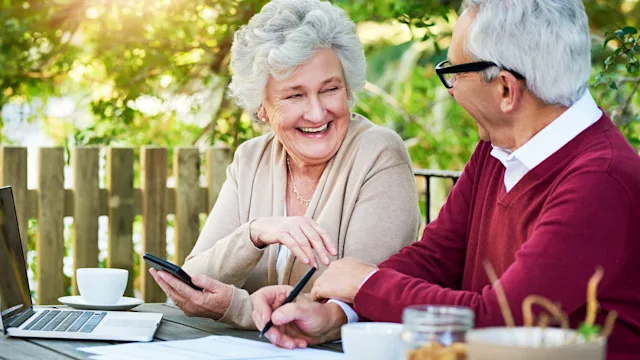 Medicare: Combining: senior couple doing finances 1126133016