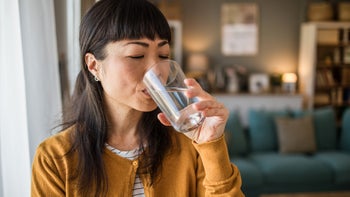 Diet Nutrition: woman drinking a glass of water 2135782293
