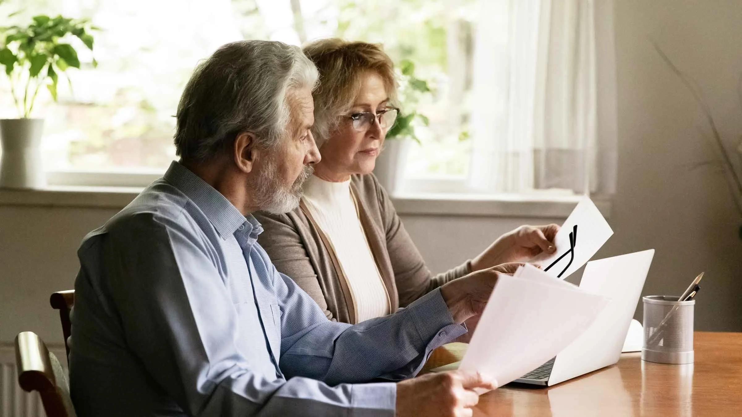 A man and a woman are working on their finances.