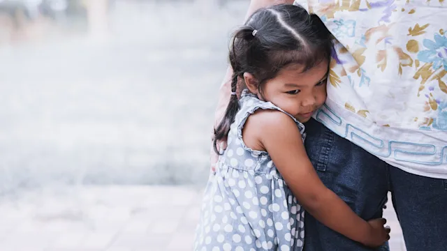 Anxiety: Childhood worries: child-hugging-parents-leg-683914786