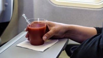 diet-nutrition: closeup glass of tomato juice 958552090
