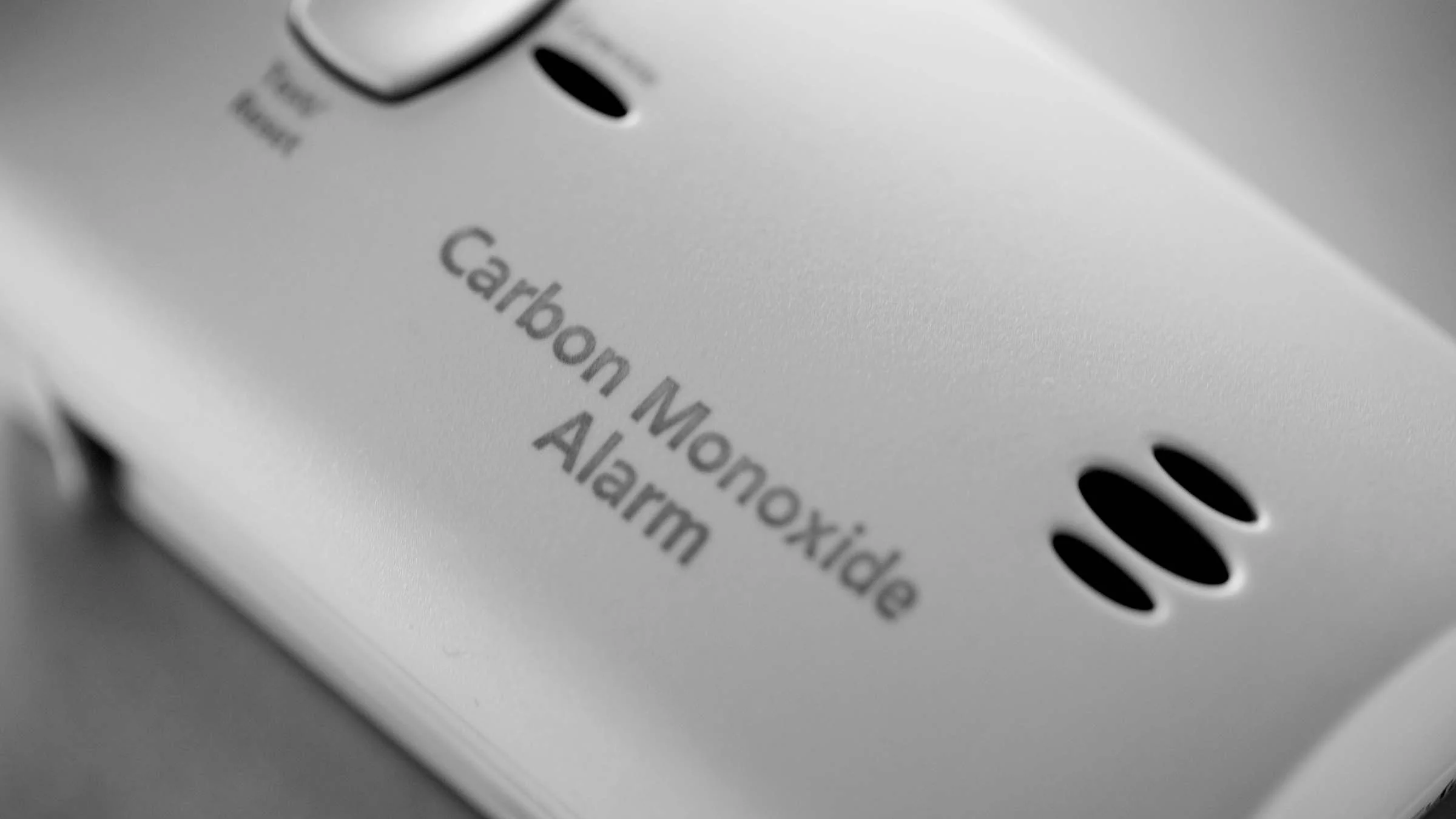 Black-and-white close-up of a carbon monoxide detector.