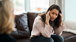 A woman is having a therapy session with a psychologist.
PeopleImages/iStock via Getty Images Plus
