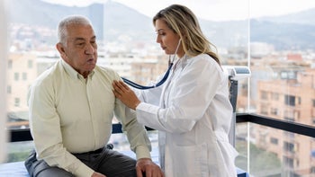 coronary artery disease: listening to heartbeat stethoscope 1404912245