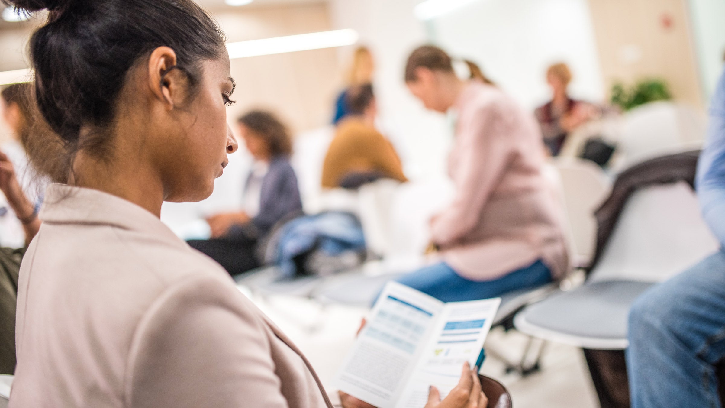 Health: Medicaid: reading brochure waiting room 941762278
