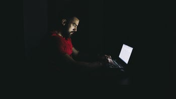 Addiction: Porn: dark room laptop light on man-1183705988