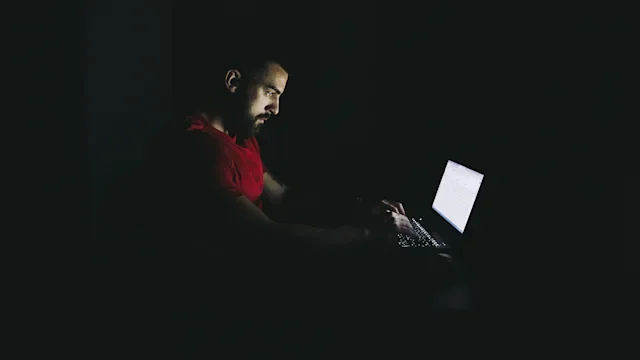 Addiction: Porn: dark room laptop light on man-1183705988
