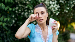 A woman rubs her itchy eye.
YorVen/iStock via Getty Images Plus
