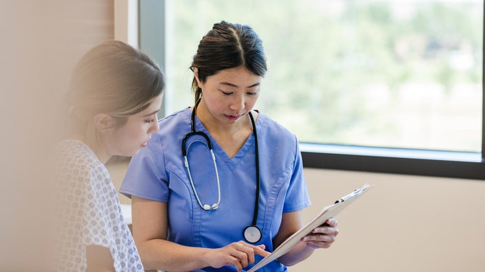 A doctor discusses some test results with a patient.