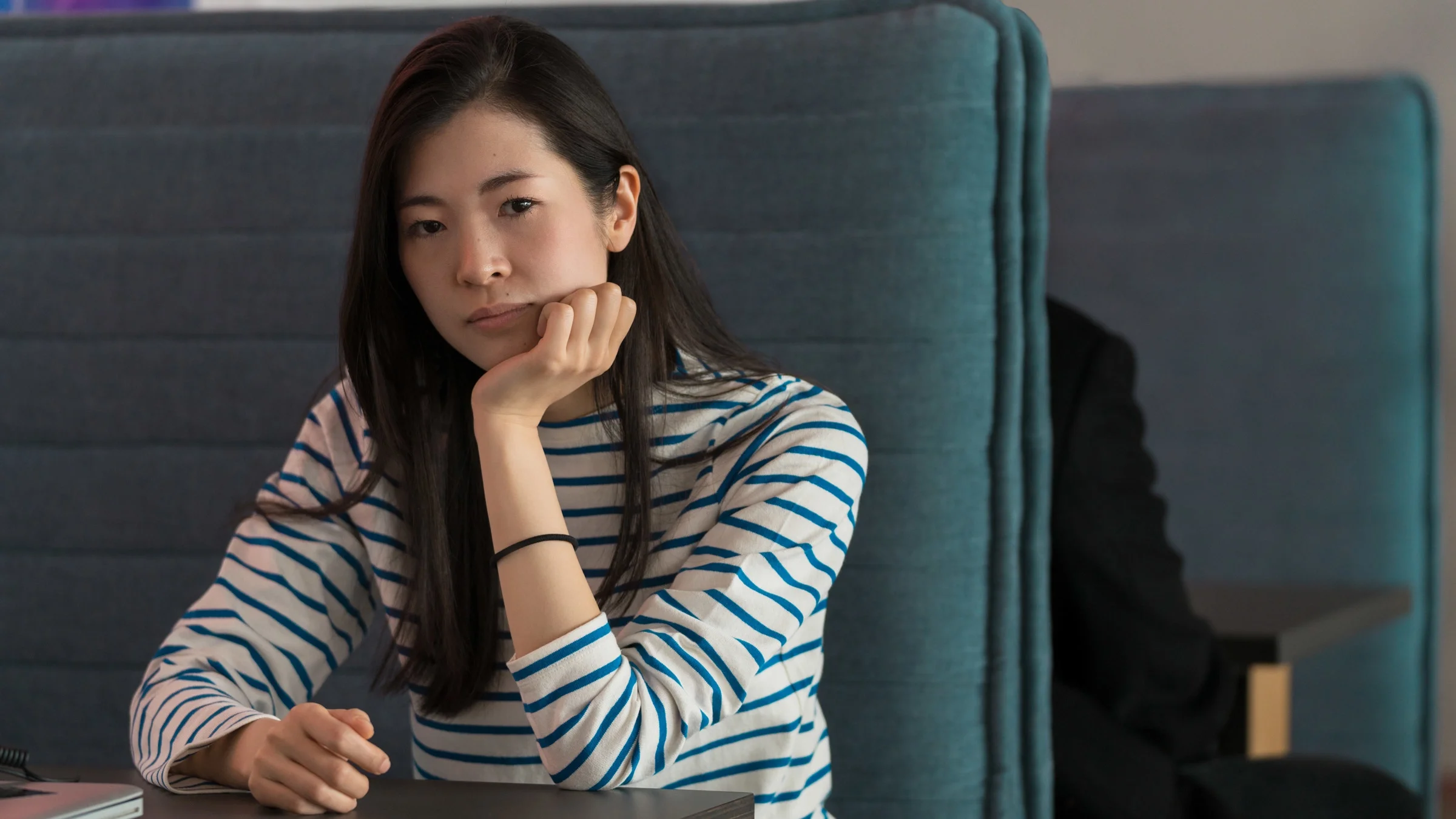 A portrait of a contemplative person who looks stressed out.