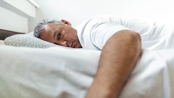Alcohol use disorder: restless man in bed 1221076759