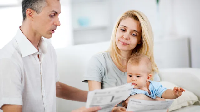 Health: Medical debt: man and woman looking at medical bill 184944545