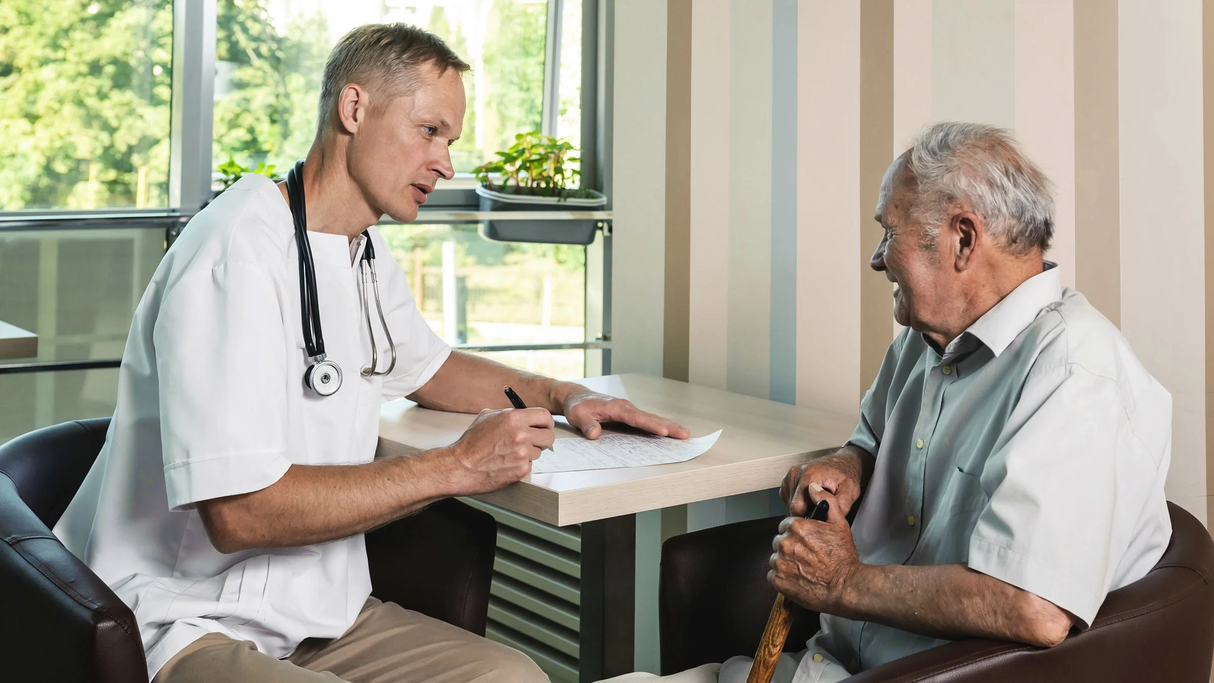 A provider is talking with an older adult about treatment options.
