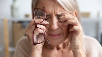 woman with eye pain-1201208592