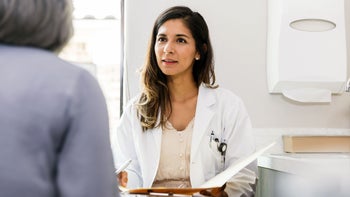 estrogen agonist antagonists: breast cancer: doctor speaking to patient 1271564717
