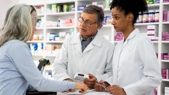 Pharmacy: pharmacists assisting a customer 1439988858