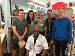 Adrian, the wonderful pharmacist at Kroger, with GoodRx team members and customers.