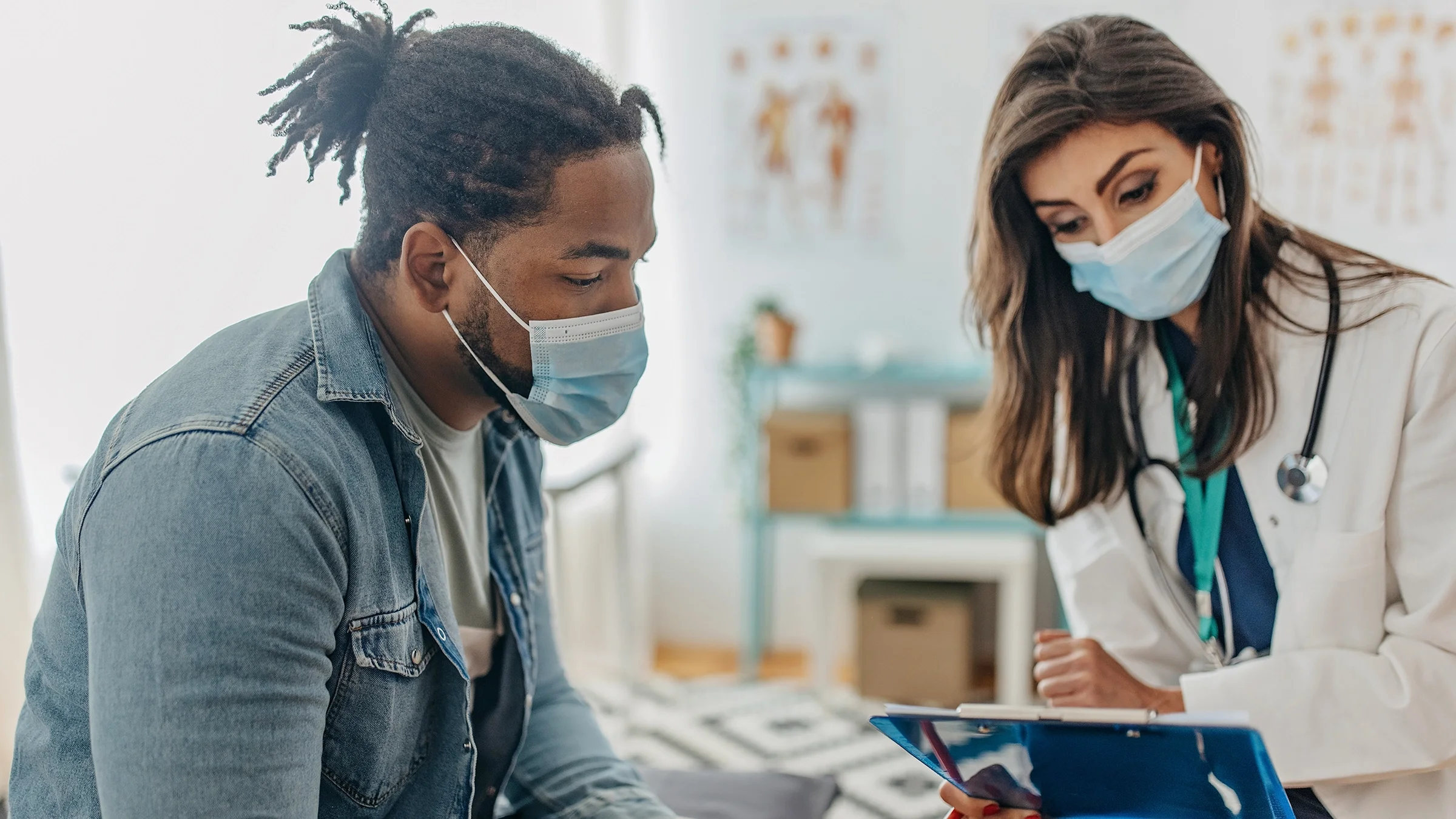 A patient has a consultation with his healthcare provider.