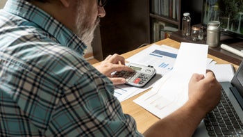 Medicaid: closeup man reviewing finances 1314438150