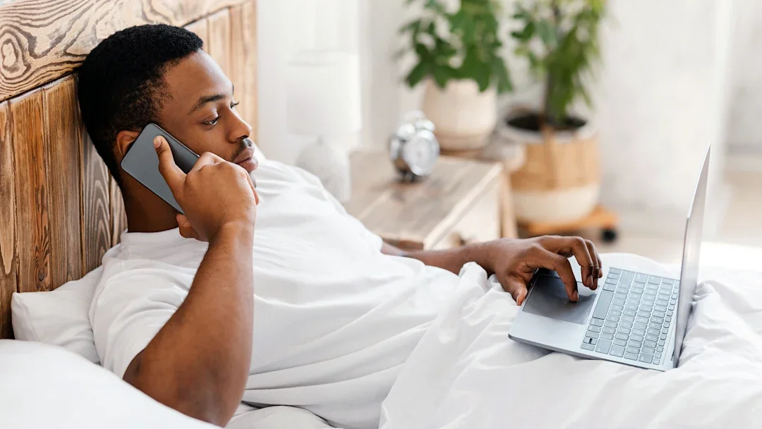 Health: Flu: man in bed on laptop 1284066475