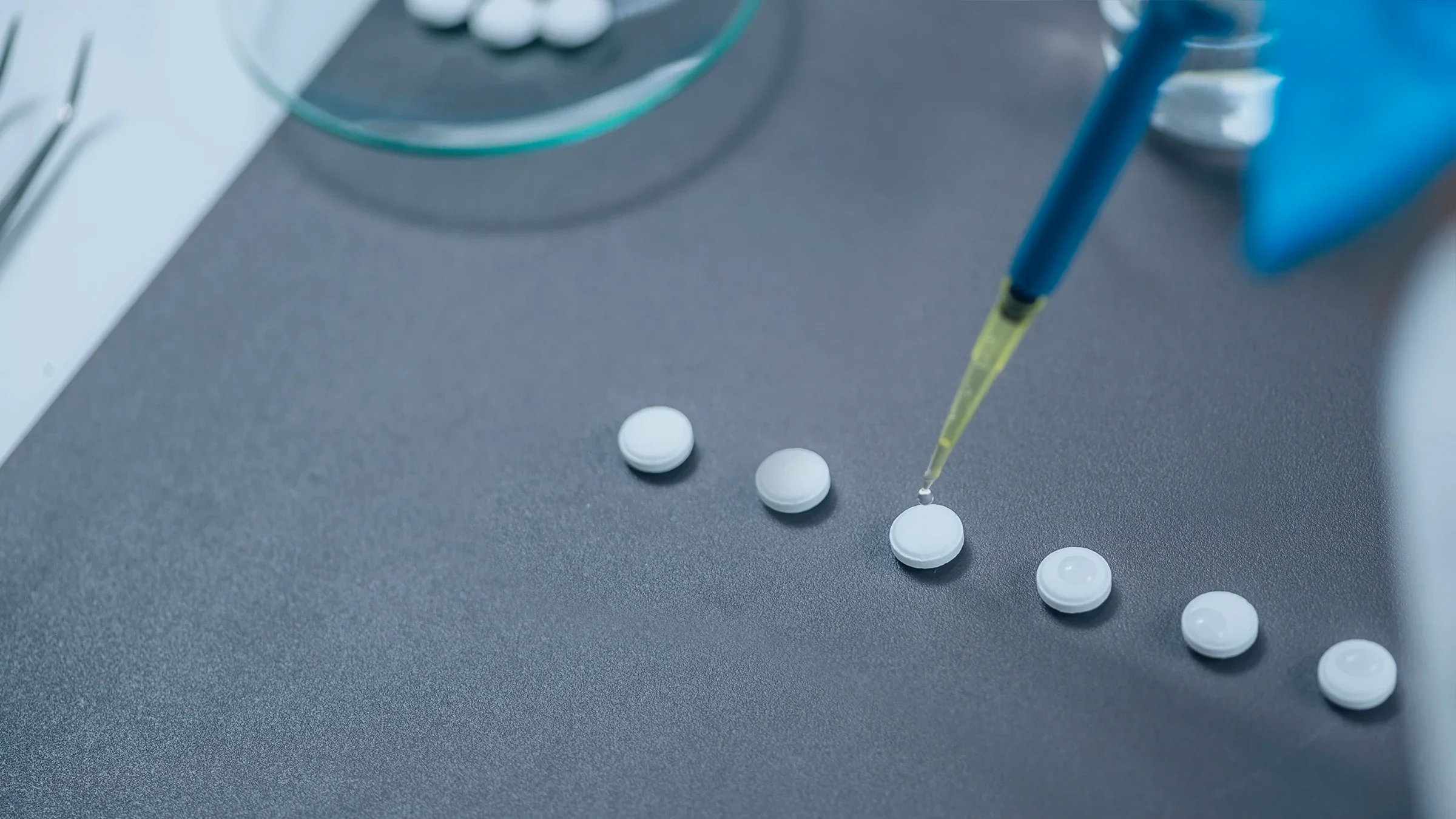 A close-up of small doses of LSD being prepared in a laboratory.
microgen/iStock via Getty Images Plus