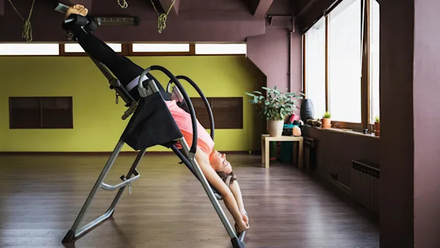 Health: Musculoskeletal: woman inversion therapy 1366018936