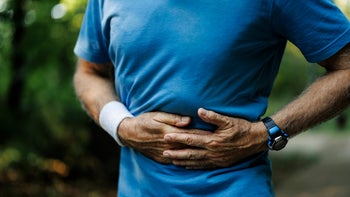 Musculoskeletal: closeup side stitch during exercise 2020772747
