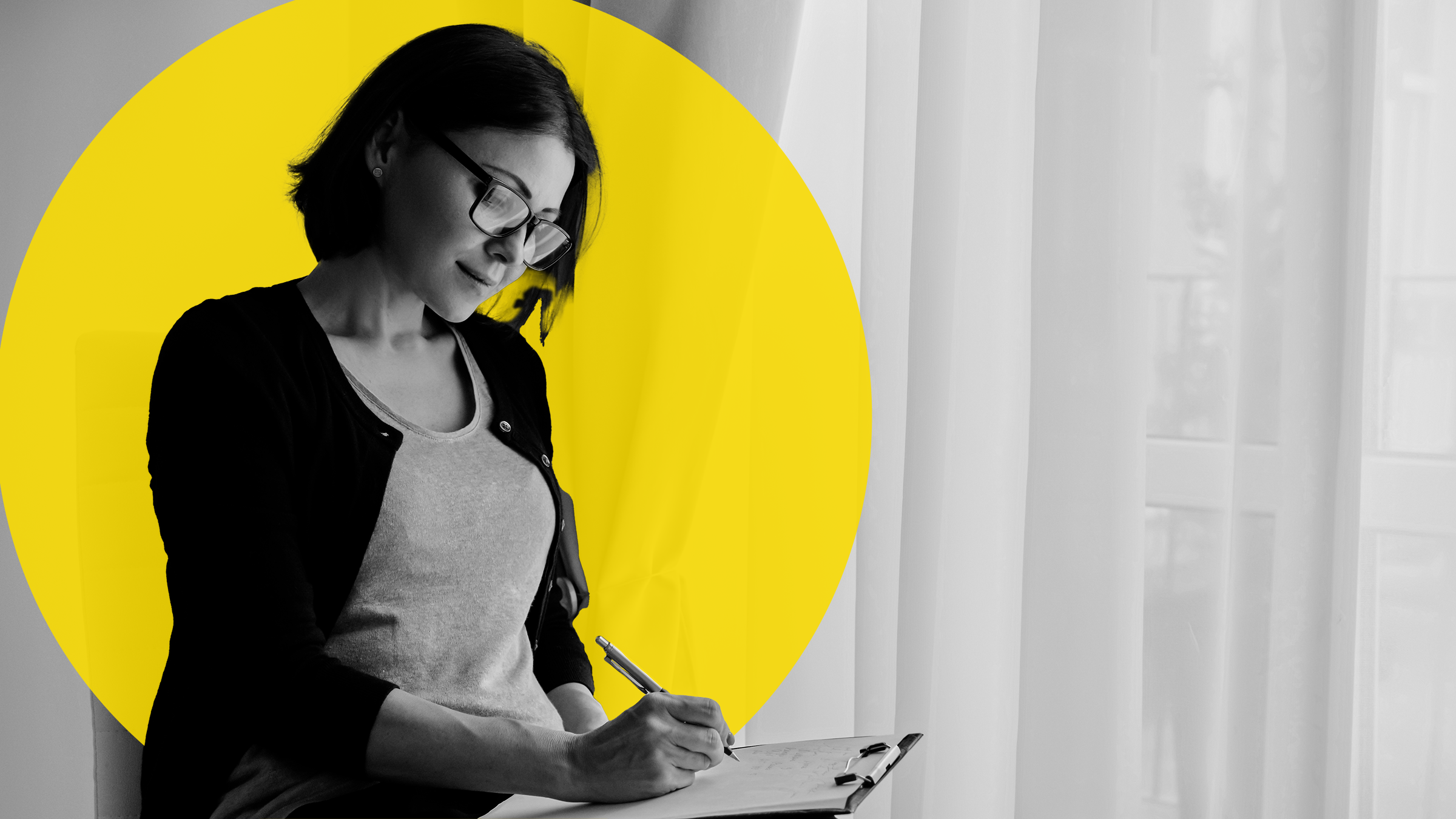 health-insurance: woman writing on clipboard-1187329331