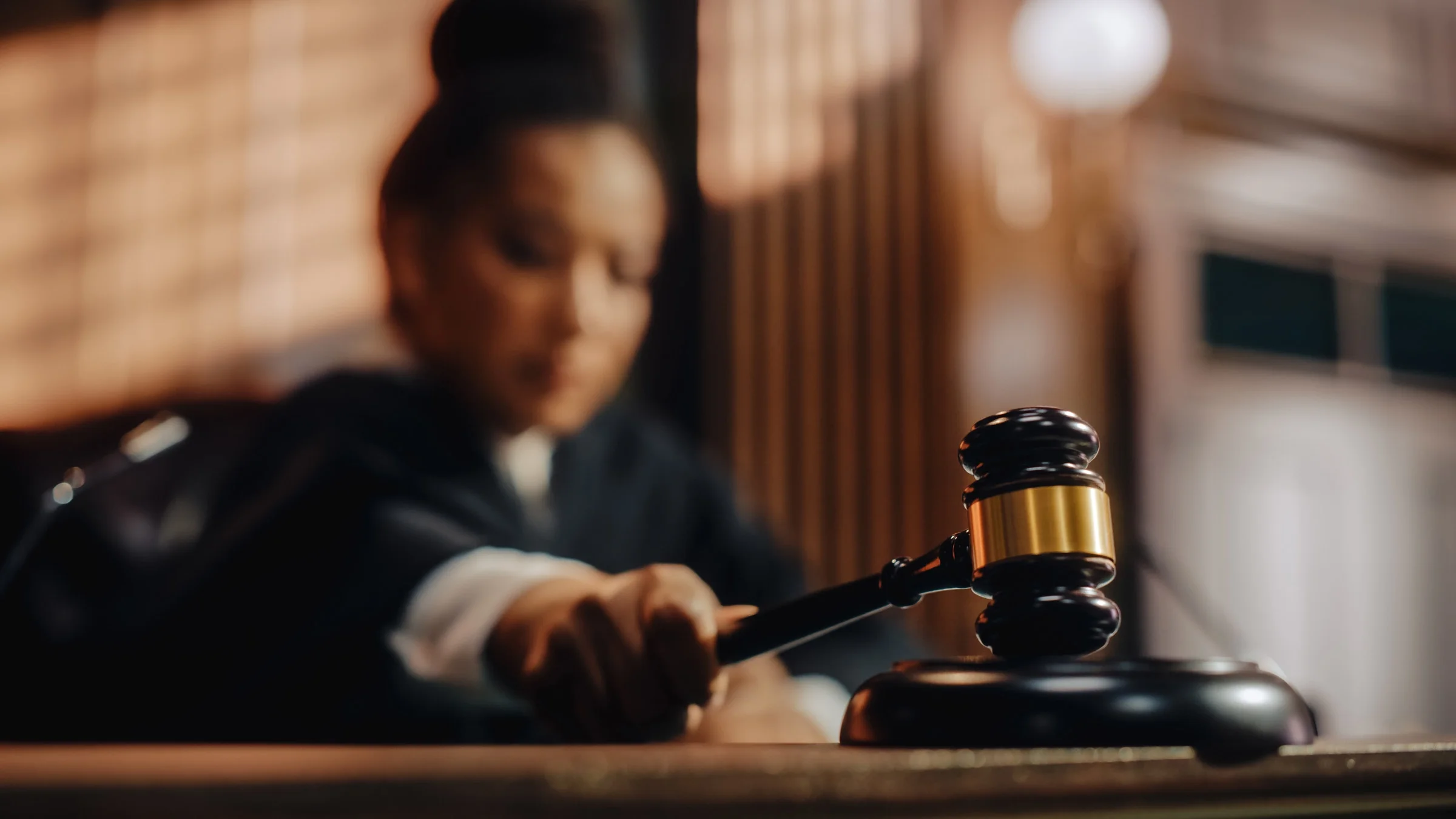 A judge striking a gavel.