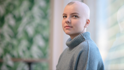 Portrait of a young woman who has alopecia.
FatCamera/iStock via Getty Images