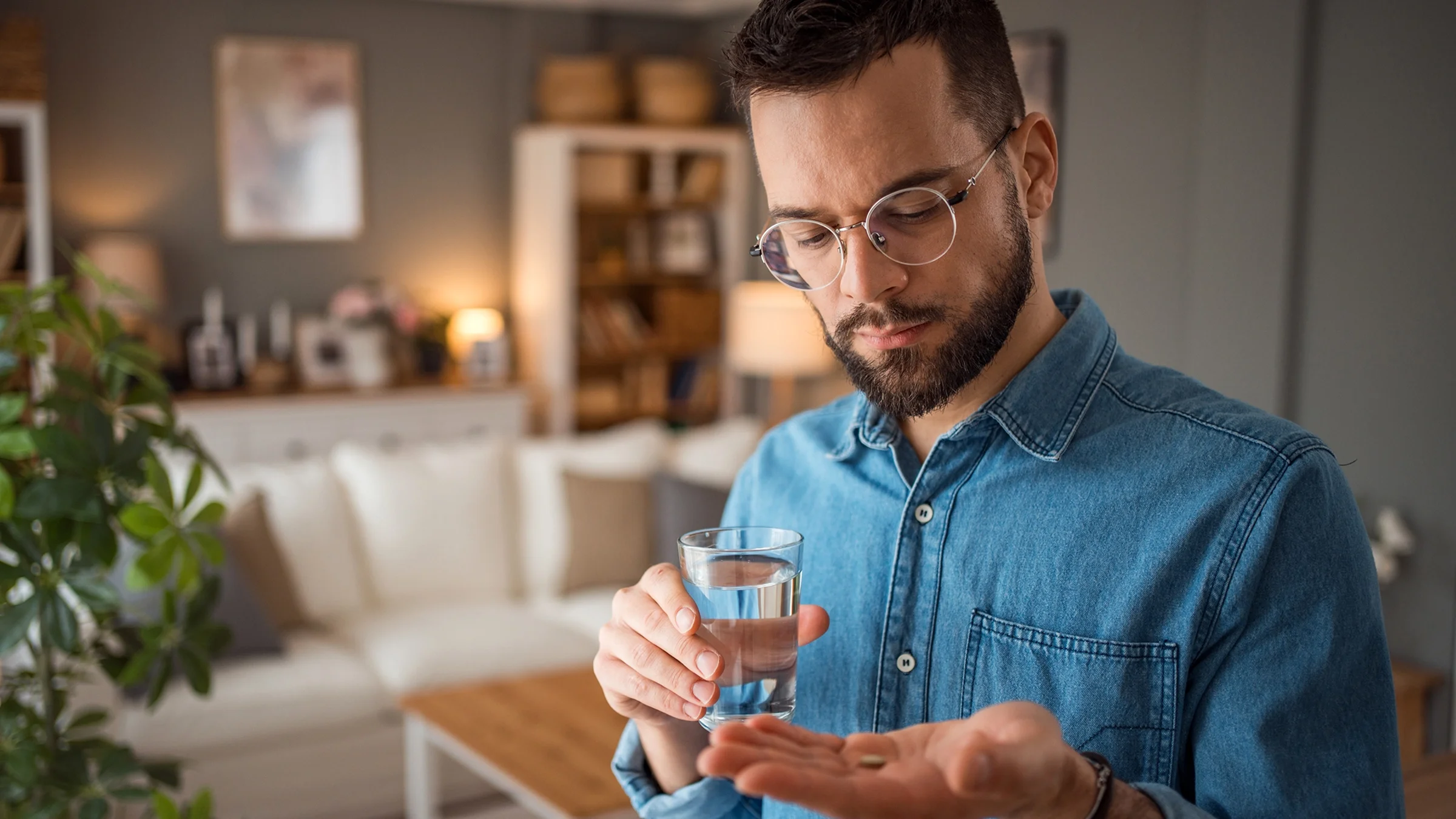 A man takes medication.