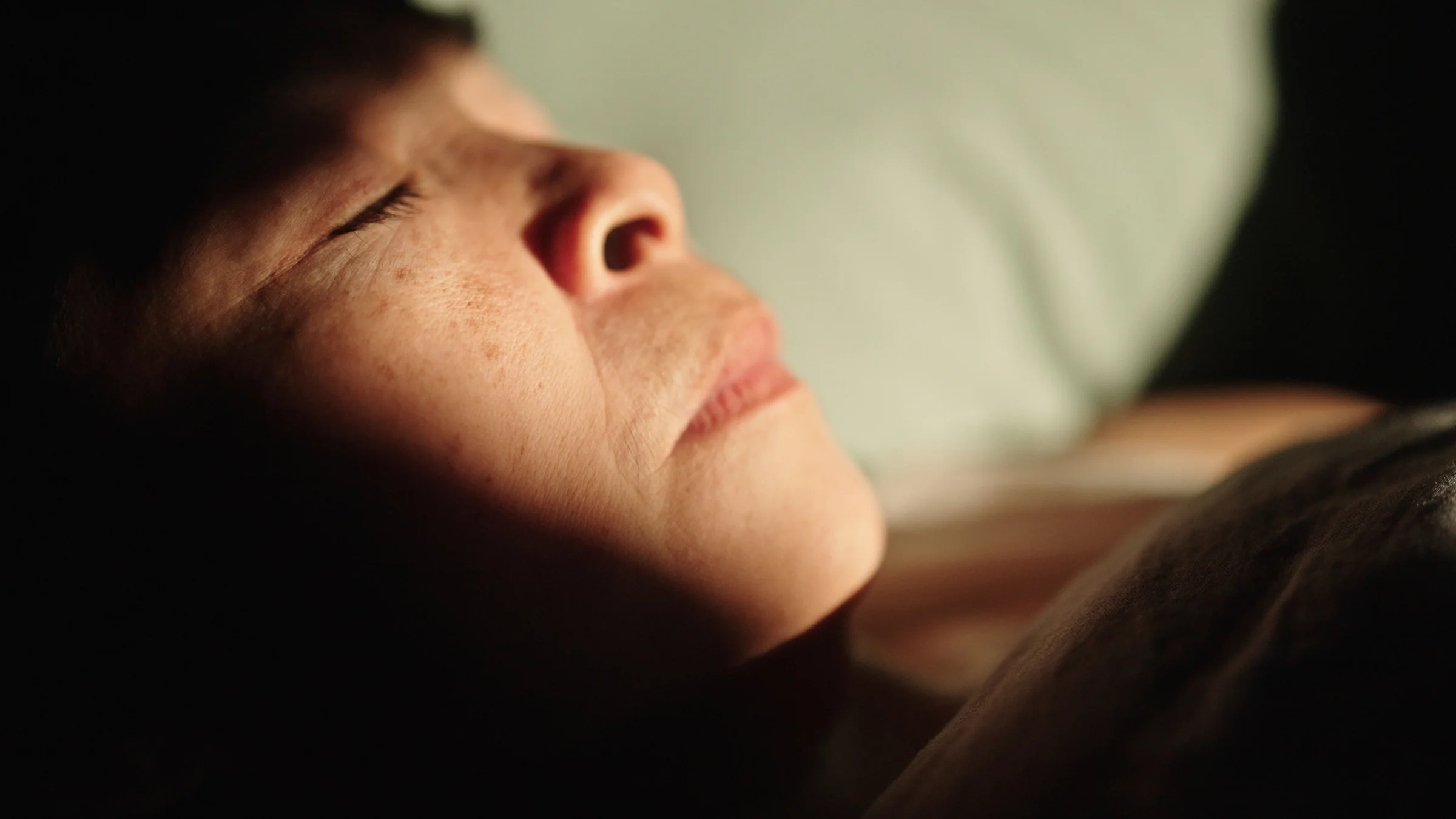 An older woman sleeps.