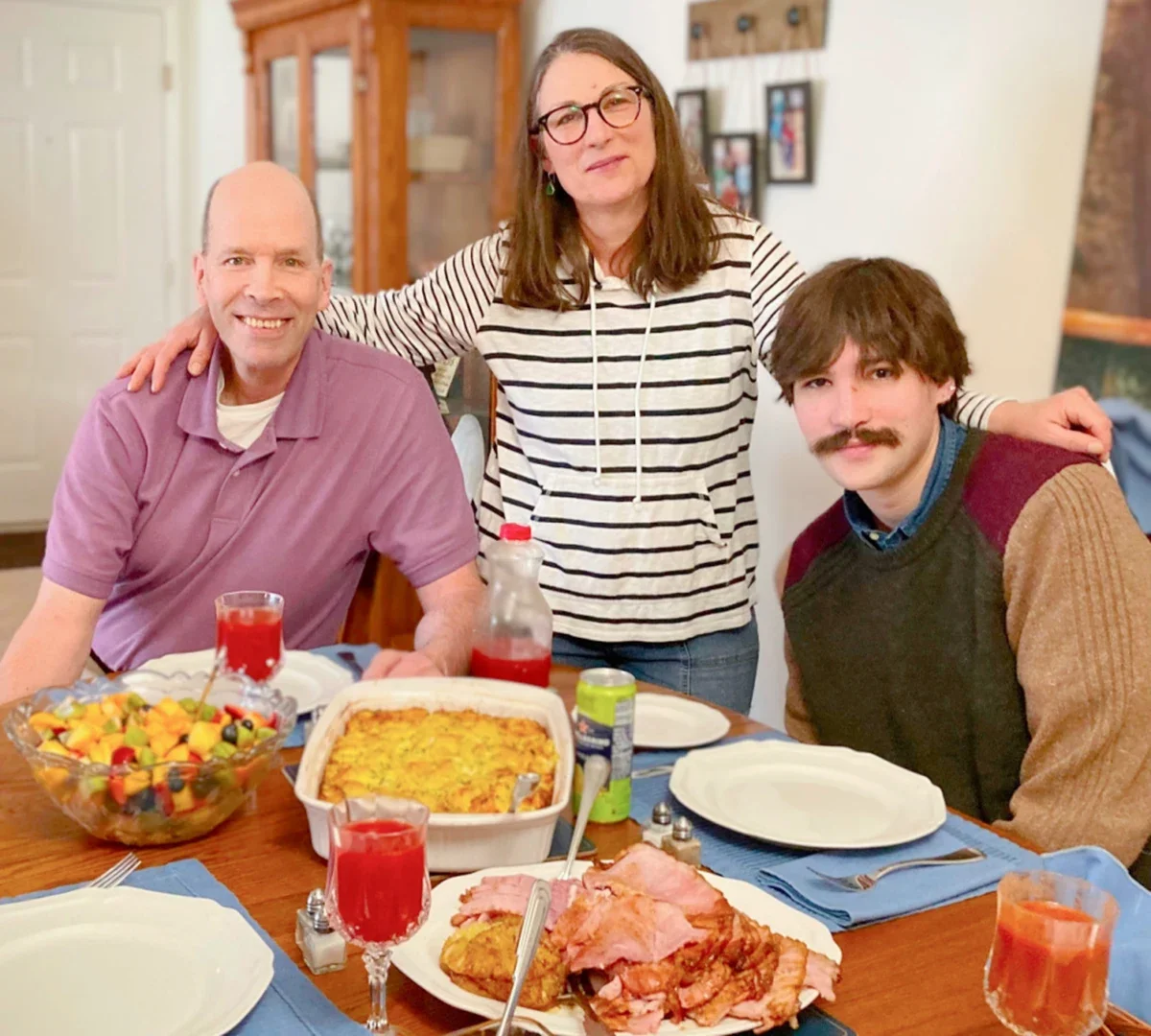 David Emerson is pictured at the dinner table at Thanksgiving with his wife, Dawn, and son, Alex.