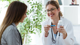 A doctor explaining a medication to a patient. 
nensuria/iStock via Getty Images Plus 