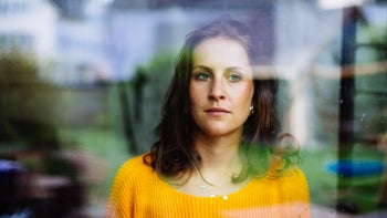 atypical antidepressants: withdrawal: sad person looking out window 1201429767