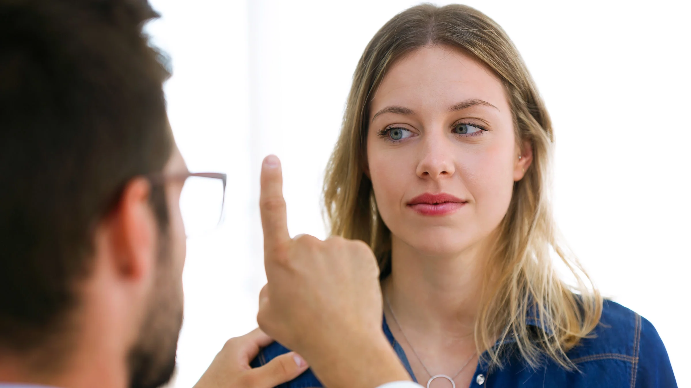 A patient following their doctors finger with their eyes.