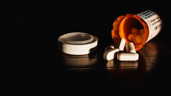 Research: Anxiety and depression COVID: rx bottle dark background 1135337514