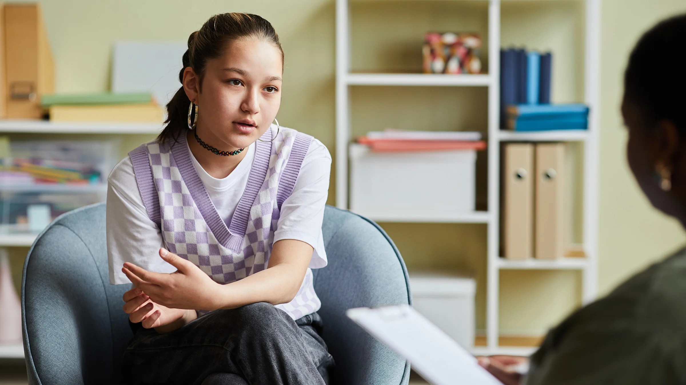 Teenager speaking to a therapist