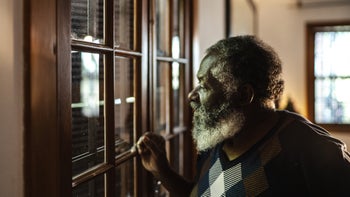 Health: Donepezil: senior man looking out window 1345489449