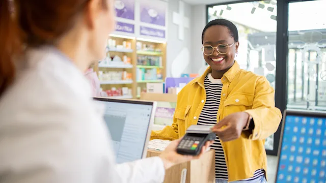 :Drug-Cost-&-Savings: woman shopping at pharmacy 2064277362