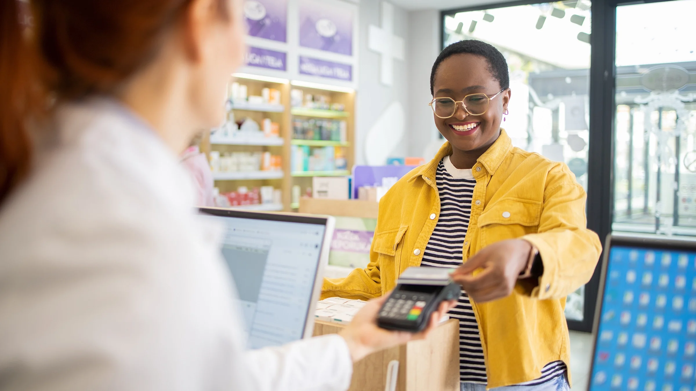 A woman shops at a pharmacy.