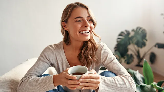 Diet Nutrition: woman enjoying a cup of coffee 2096137422