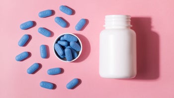 truvada: prep pills with bottle on pink background-1336395404