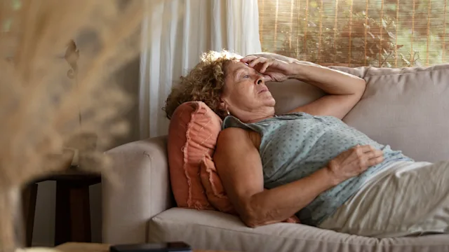 Hypokalemia: Fatigue: senior woman laying on a couch 1476743850