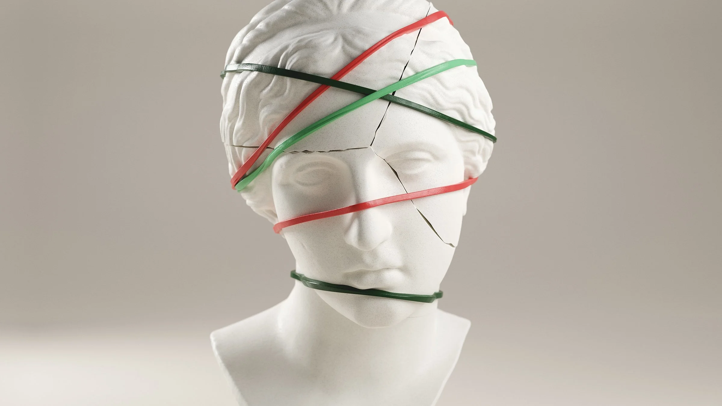 A statue head has rubber bands around it.