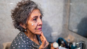 Dermatology: senior woman evening skincare routine 1435063456