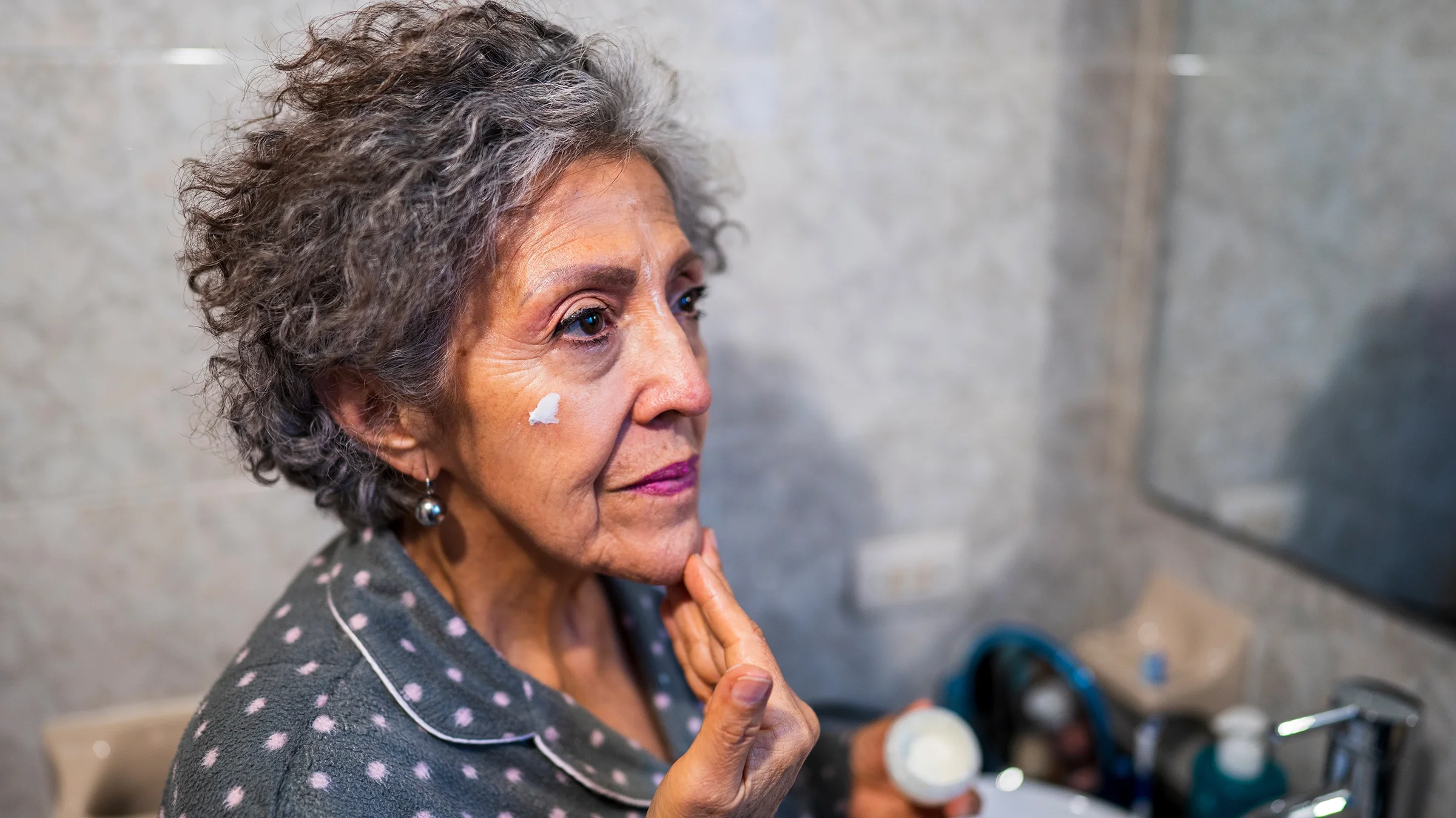 Older woman evening skincare routine.