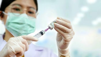 Remicade: woman syringe vile 1200979674