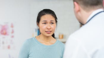 PCOS: woman at medical appointment 1138504786